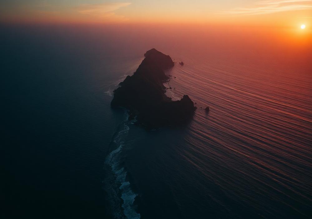 Aerial view of a coastline at sunset